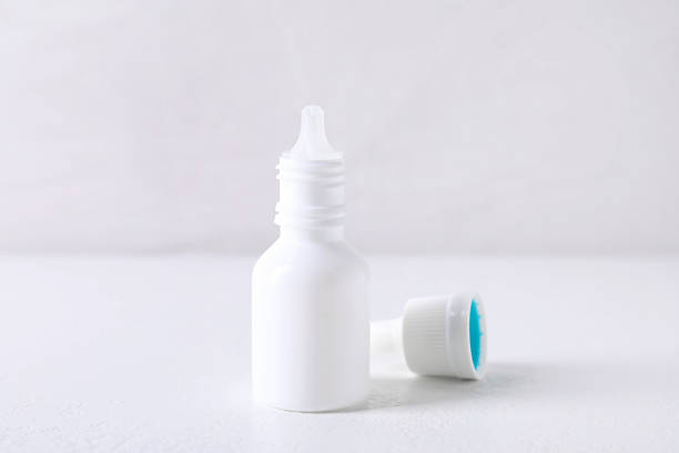 istock Bottle of medical drops on white background 2244072873