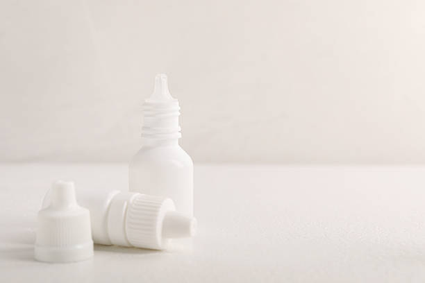 istock Bottles of medical drops on white background, space for text 2244072880