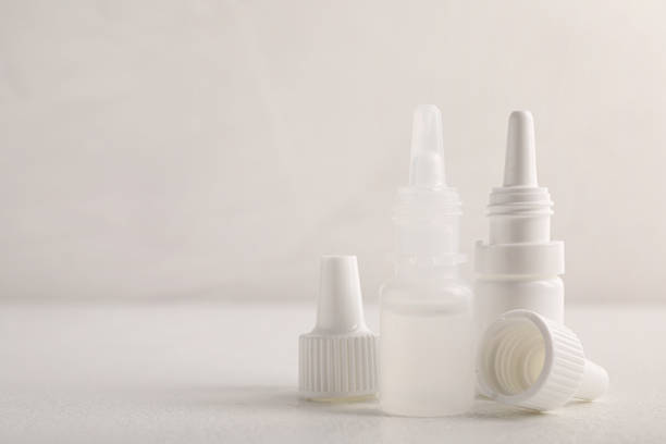 istock Bottle of medical drops on white background, space for text 2244072883