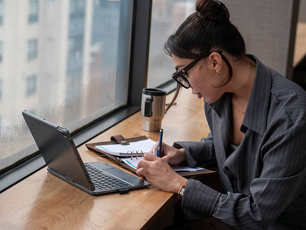 istock Female CEO Working On Laptop At Desk 2244072950
