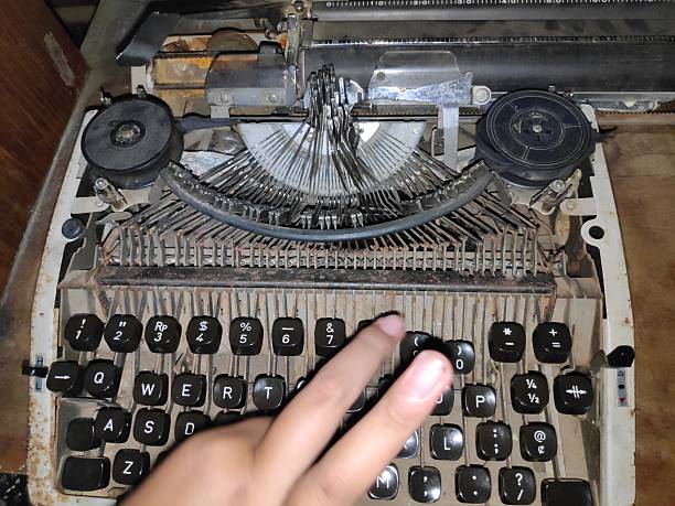 istock Hand typing on vintage typewriter in dusty room 2244076348
