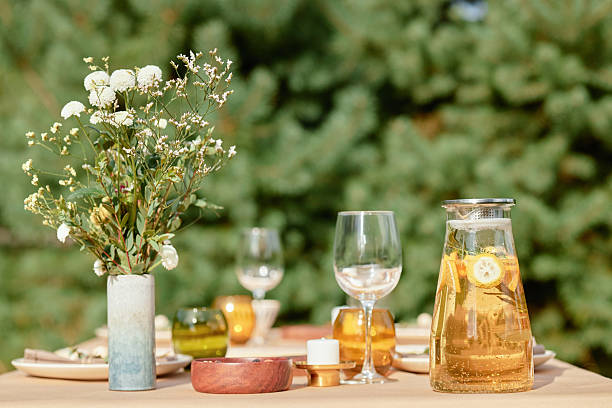 istock Outdoor Table Setting Featuring Glass Pitcher with Lemon Infused Beverage 2244078073