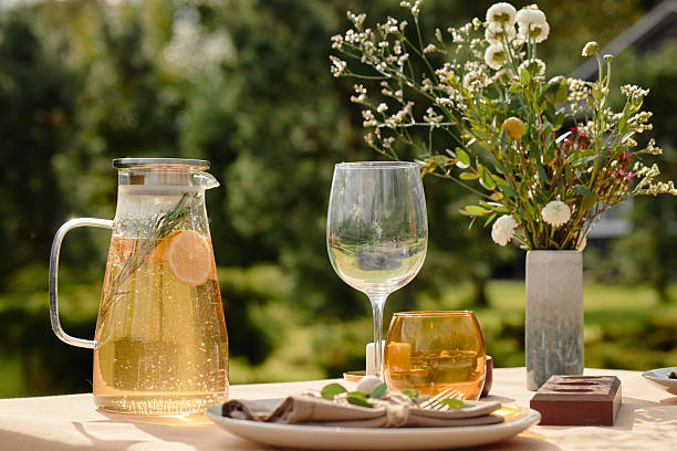 istock Refreshing Summer Drink and Table Setting Awaiting Outdoor Garden Gathering 2244078399