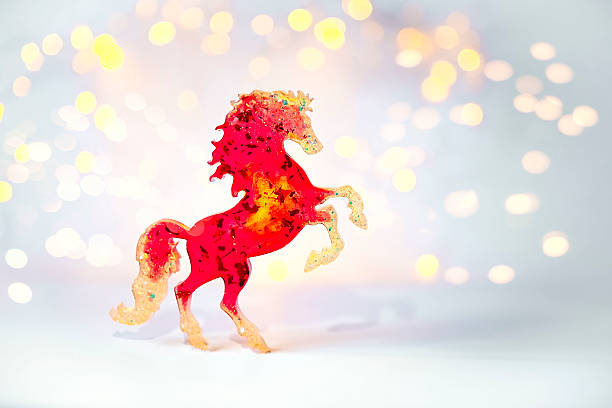 istock A bright red toy horse on a light background with bokeh. 2026 Symbol 2244091496