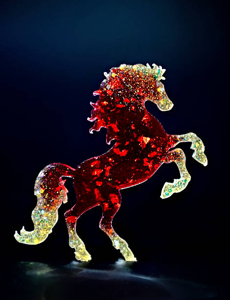 istock A bright red toy horse on a black background. 2026 Symbol 2244091497