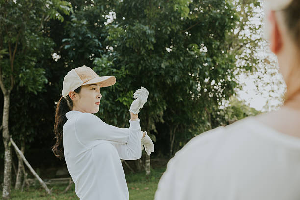 Two Thai golfer are stretching before playing golf at golf club