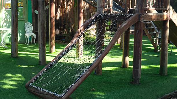 istock Wooden Rope Net or Climbing Frame in Playground. 2244093498