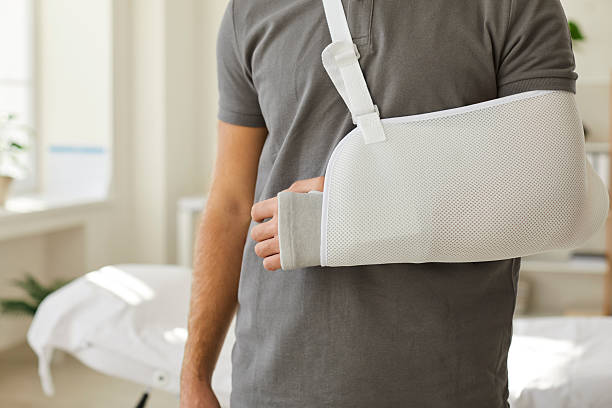 istock Man wear sling bandage on broken hand 2244097213