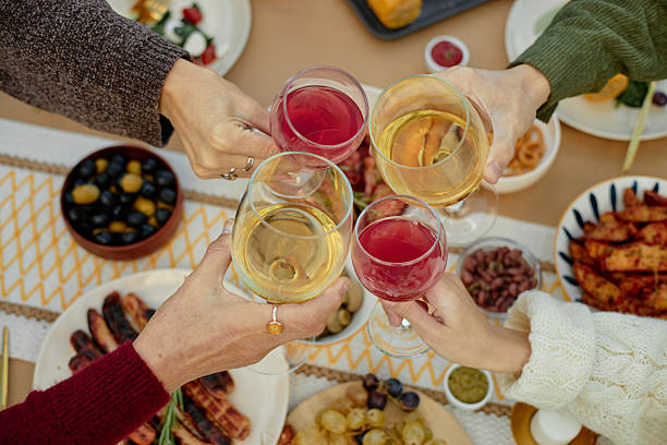 istock Group of People Toasting Glasses during Festive Gathering 2244097805