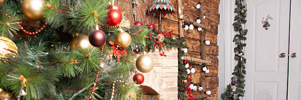 istock Christmas tree with decorative ornaments and gift boxes on floor for winter holiday celebration. Festive home decor for new year. 2244100376