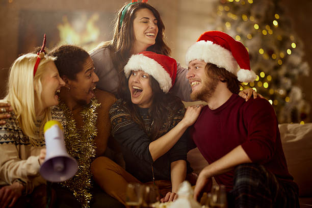 istock Cheerful friends having fun during Christmas at home. 2244100801