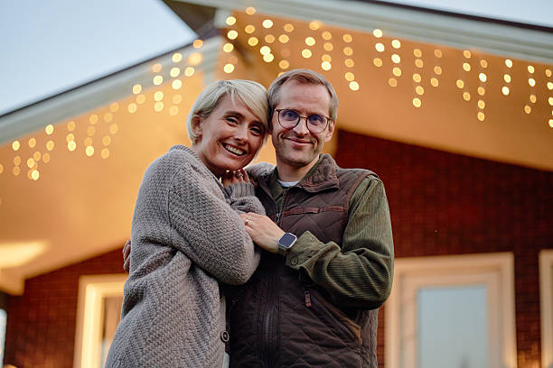 istock Caucasian Couple Smiling and Embracing Outdoors at Dusk 2244102755