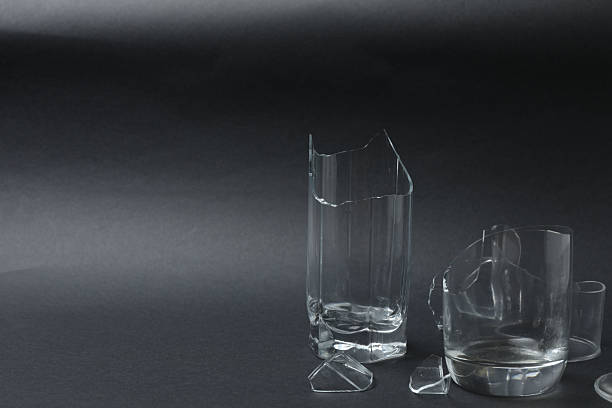 istock Fragments of broken glass on a black background 2244106209