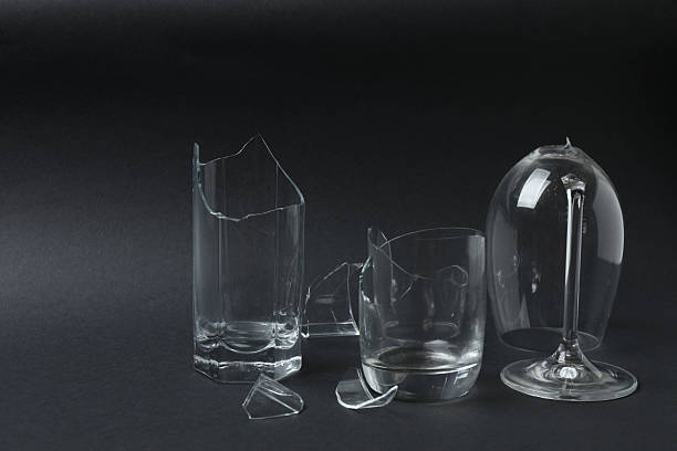 istock Fragments of broken glass on a black background 2244106255
