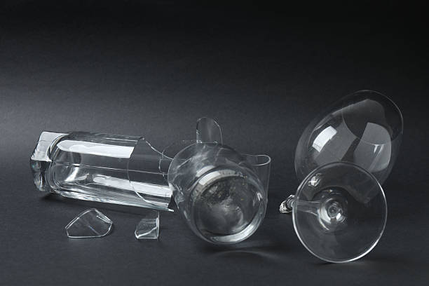 istock Fragments of broken glass on a black background 2244106311