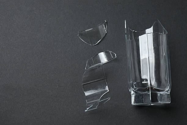 istock Fragments of broken glass on a black background 2244106337