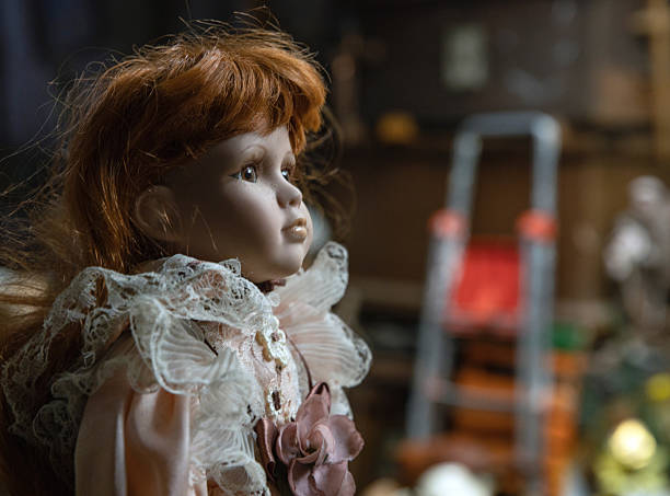istock Head of an antique doll at second hand shop 2244112120