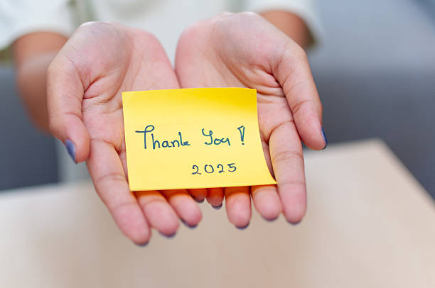 istock Expressing gratitude thank you note workplace indoor close-up appreciation 2244113943
