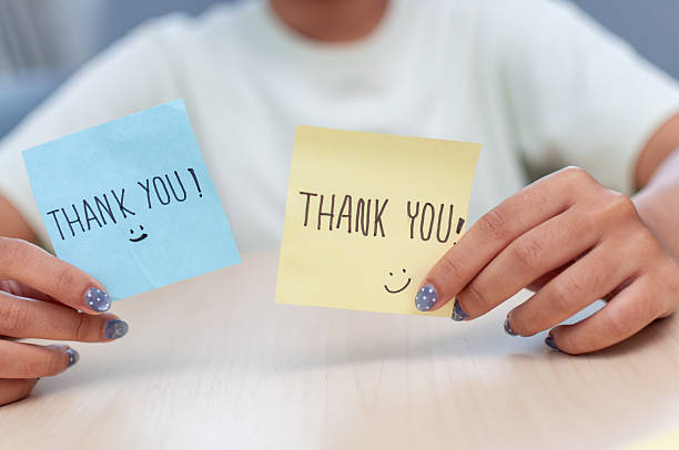 istock Expressing gratitude thank you notes office setting digital bright atmosphere close-up view 2244114214