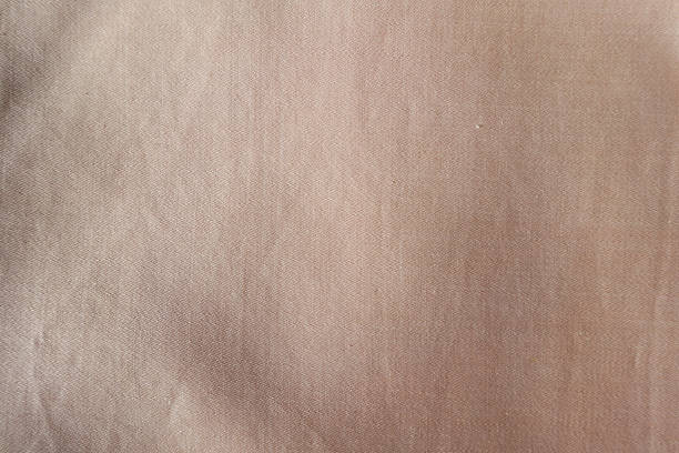 istock Surface of unprinted muted pink ticking fabric 2244114323