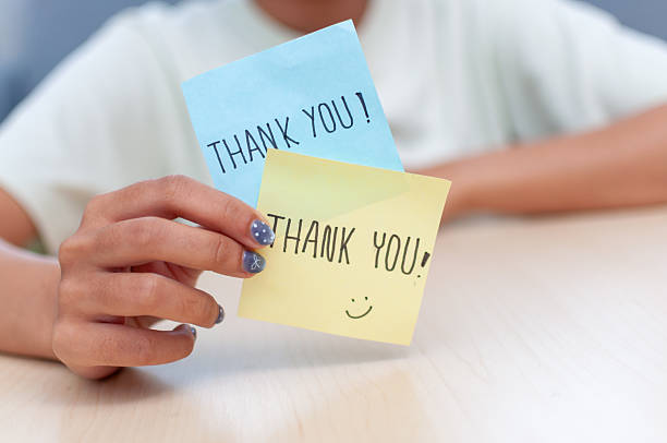 istock Gratitude gesture thank you notes home office welcoming environment close-up appreciation 2244114527