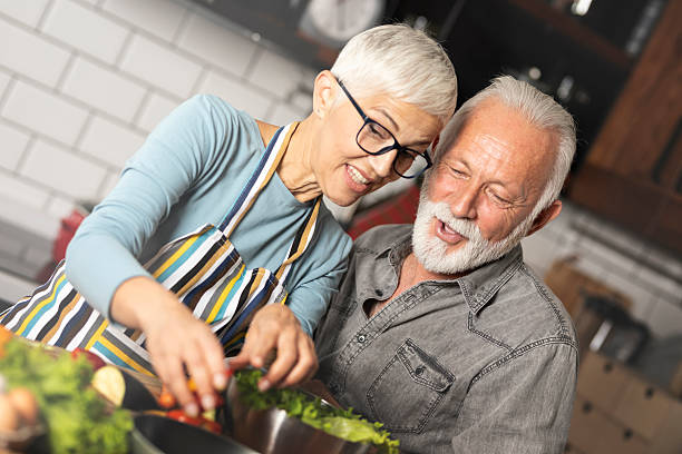 istock Happy senior couple making a healthy salad 2244120926