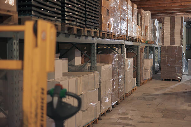 istock Warehouse interior displaying goods on pallets and shelving 2244121530