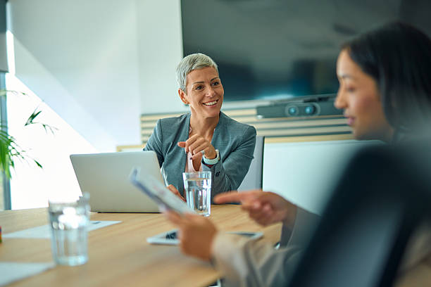 istock Business women discussing strategy during office meeting 2244127585