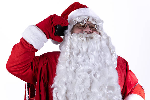 istock Santa Claus is on the phone, possibly taking wish lists from children 2244127603