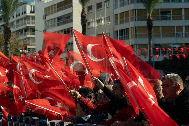 Izmir, Turkey - Oct 29 2025: People of Izmir waving flags enthusiastically while watching performances during Republic Day celebrations at Alsancak Square