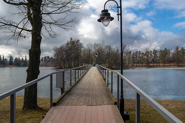 Long bridge to the island on the pond