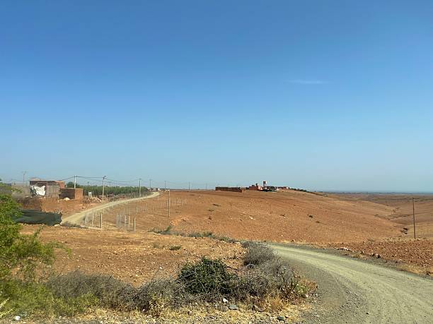 istock Morocco rural landscape with dirt road and distant village 2244137840