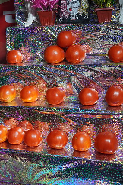 Pyramid Stack of Shiny Ripe Red Tomatoes on Foil