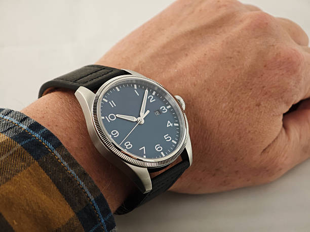 istock Minimalist Pilot Style Wristwatch with Black Dial on Man's Wrist 2244139013