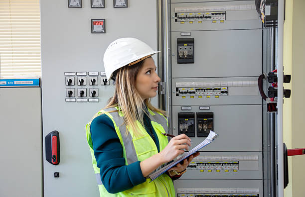 istock Female Engineer Performing Hands-On Inspection and Maintenance in Advanced Control Room of Renewable Energy Facility 2244141954