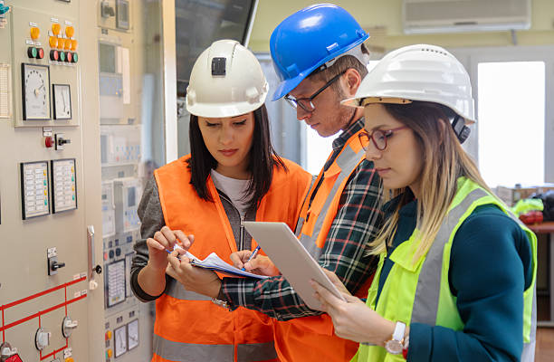 istock Team of Engineers and Technicians Monitoring Control Panel in Modern Renewable Energy Facility 2244142004