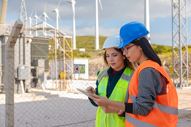 istock Two Female Engineers Using Digital Tablet for Field Data Analysis at Renewable Energy Facility 2244142024