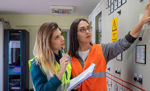 istock Two Female Engineers Collaborating on Technical Inspection in Control Room of Renewable Energy Facility 2244142031