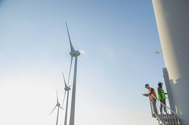 istock Engineers Inspecting Wind Turbine Tower Stairs at a Modern Renewable Energy Facility 2244142266