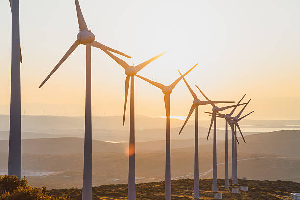 istock Wind Turbines Sunset — Renewable Energy Landscape at Dusk 2244142282