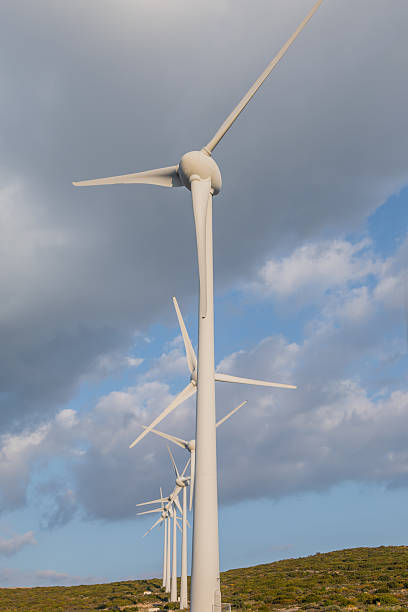 istock Wind Turbines Sunset — Renewable Energy Landscape at Dusk 2244142344