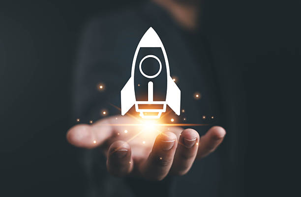 istock Businessman holding digital rocket icon, symbolizing startup growth, innovation, business development, success, and new technology modern digital concept connected network lines with business icons, 2244144276
