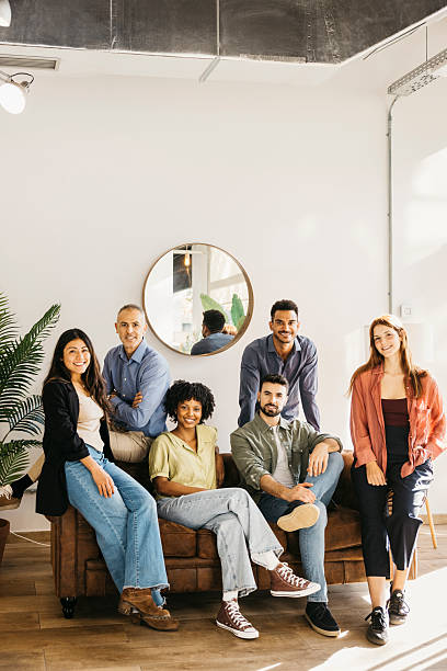 Diverse business professionals finding success working together in a modern startup office