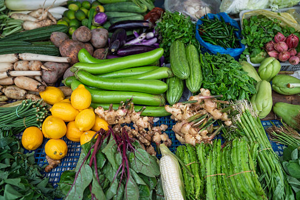 Assorted Fresh Vegetables and Herbs Displayed at Local Market in Malaysia