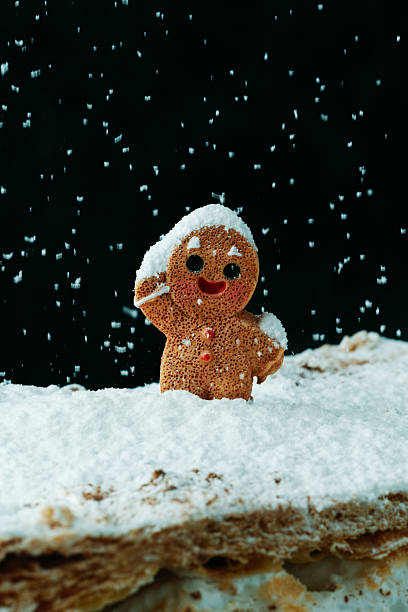 istock gingerbread man waving on meringue milhojas 2244148515