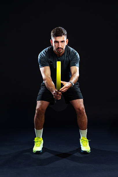 istock Training session with a male athlete using a resistance band indoors 2244150057
