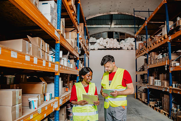 istock Warehouse workers discuss plans for effective inventory management in a distribution center 2244152473