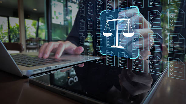 istock Legal Document Management with Justice Scale Overlay on Dual Devices 2244152681