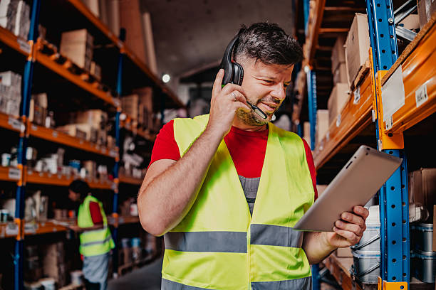 istock Warehouse workers engage in communication and coordination while managing the supply chain in a distribution center 2244154166