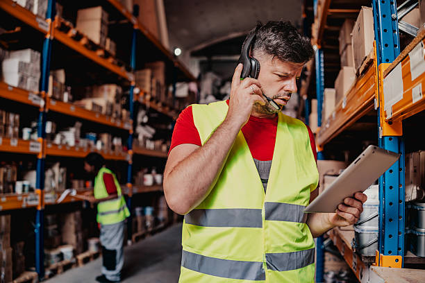 istock Warehouse workers engaged in a discussion about inventory management during a busy day at the distribution center 2244154481